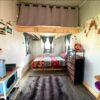 Tiny house with one sleeping loft and one storage loft.